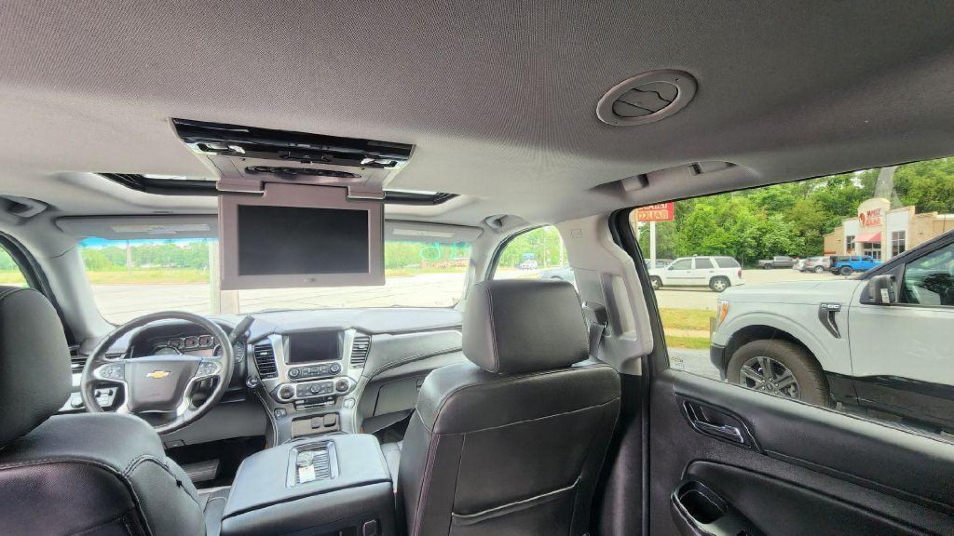 2016 BLACK CHEVROLET TAHOE 1500 LT - 4WD (1GNSKBKCXGR) with an 5.3L engine, Automatic transmission, located at 101 S. Halleck St., DeMotte, 46310, (219) 987-2922, 41.202343, -87.198189 - Photo#24